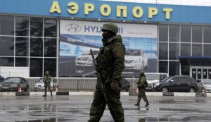 Unidentified armed men patrol outside of Simferopol airport, on February 28, 2014. (AFP)